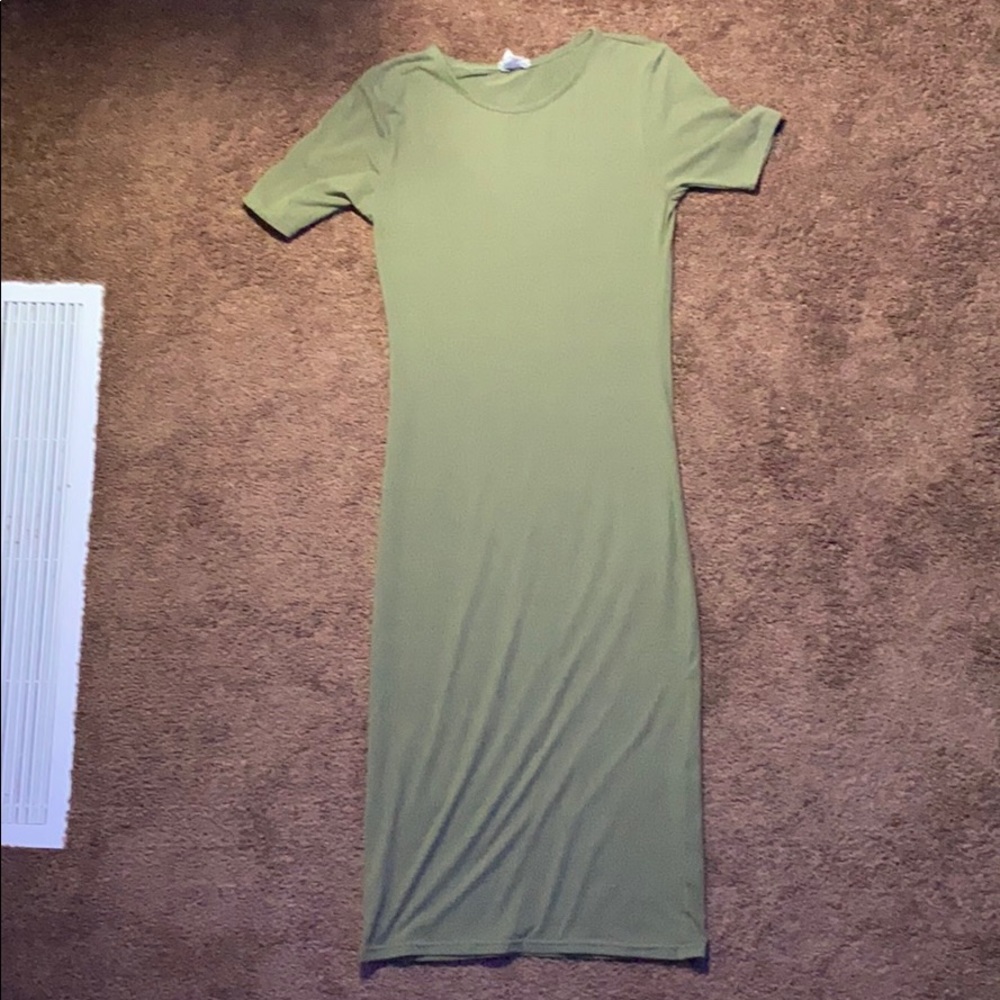 A navy green cutout shirt dress.